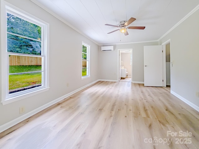 106 Cedar St, Spindale, NC 28160 - spare room with a wall unit AC, ornamental molding, light wood-style flooring, ceiling fan, and baseboards