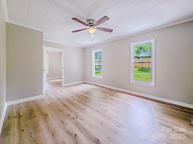 106 Cedar St, Spindale, NC 28160 - unfurnished room featuring crown molding, healthy amount of natural light, light wood-style flooring, and baseboards
