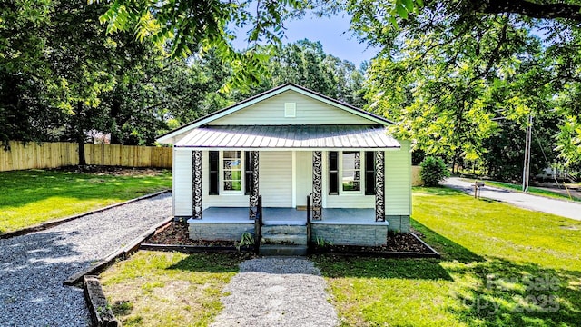 106 Cedar St, Spindale, NC 28160 - bungalow-style home with a porch and metal roof