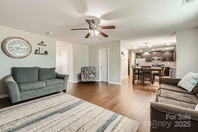 4151 Granite St, Midland, NC 28107 - living area with ceiling fan and dark wood-type flooring
