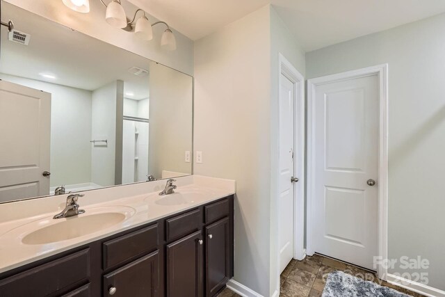4151 Granite St, Midland, NC 28107 - full bathroom featuring double vanity and stone finish floors