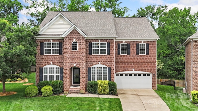 1830 Alden Oaks Ln, Charlotte, NC 28270 - georgian-style home featuring brick siding, an attached garage, concrete driveway, and roof with shingles