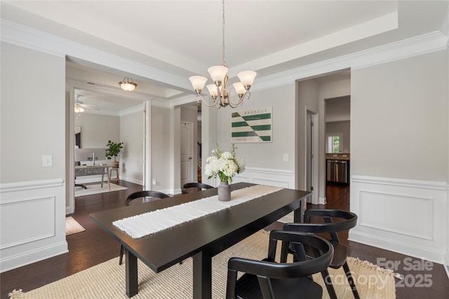 1830 Alden Oaks Ln, Charlotte, NC 28270 - dining area with a chandelier, dark wood-type flooring, wainscoting, ornamental molding, and a decorative wall