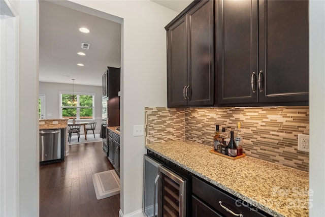 1830 Alden Oaks Ln, Charlotte, NC 28270 - kitchen with stainless steel dishwasher, dark wood-style flooring, light stone counters, beverage cooler, and recessed lighting