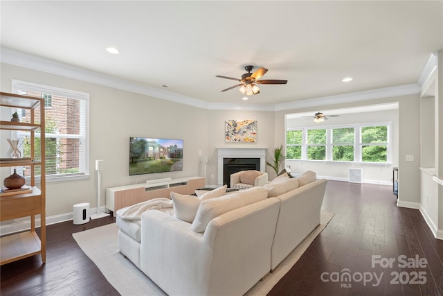 1830 Alden Oaks Ln, Charlotte, NC 28270 - living room with ceiling fan, a fireplace, dark wood-type flooring, ornamental molding, and recessed lighting