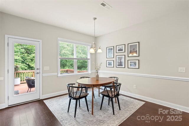 1830 Alden Oaks Ln, Charlotte, NC 28270 - dining room with dark wood-style floors and a chandelier