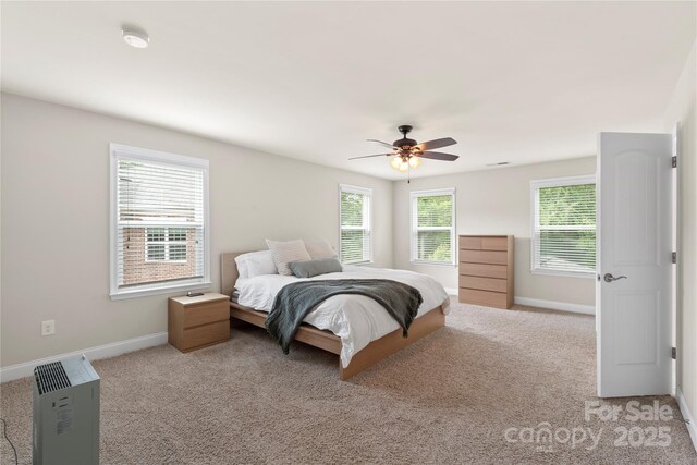 1830 Alden Oaks Ln, Charlotte, NC 28270 - bedroom featuring light carpet, multiple windows, and a ceiling fan