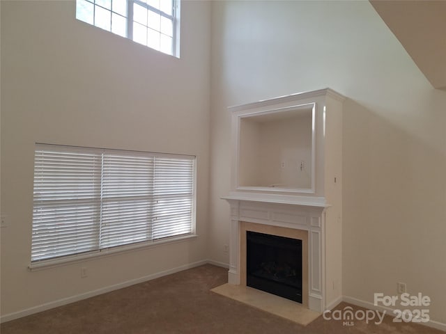 8838 Wandering Creek Way, Charlotte, NC 28227 - unfurnished living room featuring a fireplace with flush hearth and carpet flooring