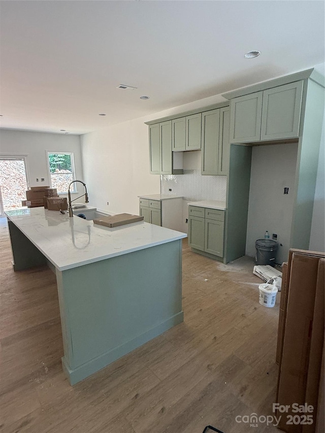 1923 Fairfield Rd, Mount Gilead, NC 27306 - kitchen with wood finished floors, a large island, decorative backsplash, and recessed lighting