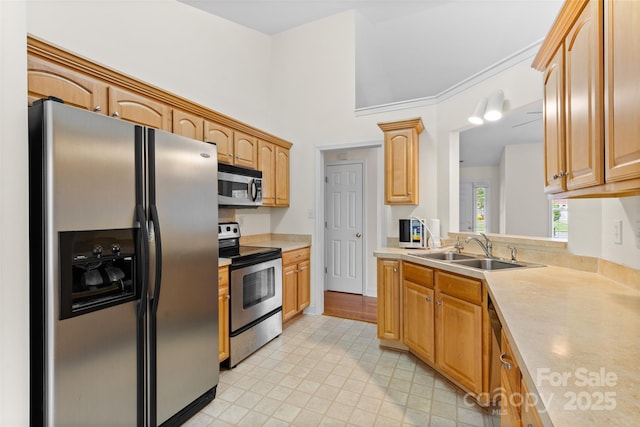 5707 Sustar Dr, Monroe, NC 28110 - kitchen featuring appliances with stainless steel finishes, light countertops, and vaulted ceiling