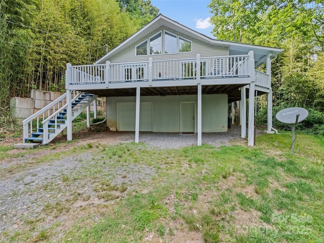 848 Eagles Ridge Rd, Sylva, NC 28779 - rear view of property featuring a garage, a deck, stairway, driveway, and a carport