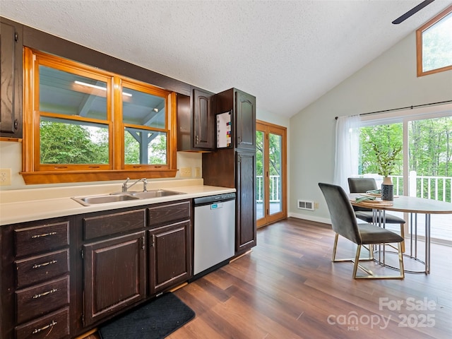 848 Eagles Ridge Rd, Sylva, NC 28779 - kitchen with a sink, stainless steel dishwasher, vaulted ceiling, light countertops, and dark wood-style flooring