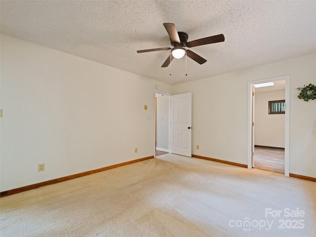 848 Eagles Ridge Rd, Sylva, NC 28779 - spare room featuring ceiling fan, light colored carpet, baseboards, and a textured ceiling