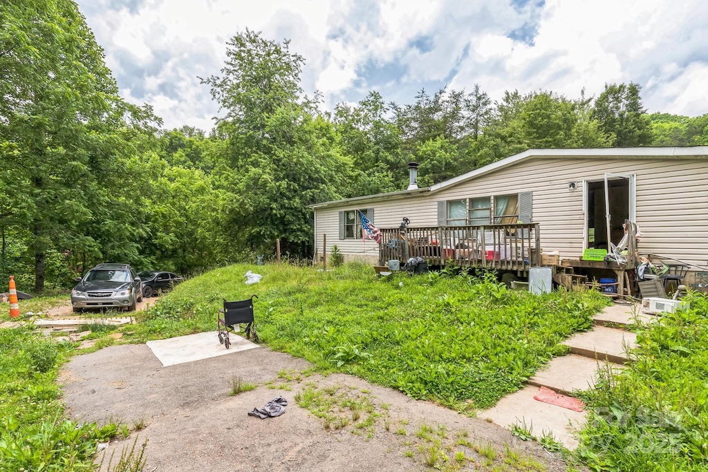 54 Lemon Creek Dr, Candler, NC 28715 - view of yard featuring a wooden deck