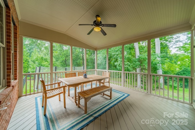 2004 Viscount Dr, Matthews, NC 28104 - sunroom / solarium featuring a ceiling fan, outdoor dining space, vaulted ceiling, and view of scattered trees