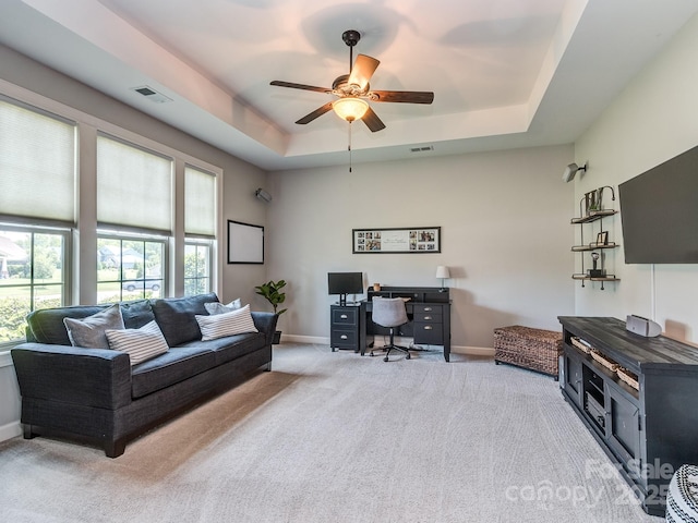314 Candella Dr, Matthews, NC 28104 - living room with a tray ceiling, carpet floors, a ceiling fan, and baseboards