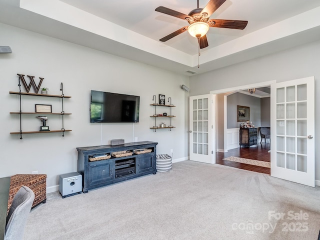 314 Candella Dr, Matthews, NC 28104 - carpeted living room with french doors, ceiling fan, and baseboards