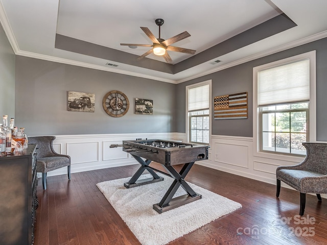 314 Candella Dr, Matthews, NC 28104 - playroom with a tray ceiling, a ceiling fan, healthy amount of natural light, ornamental molding, and dark wood finished floors