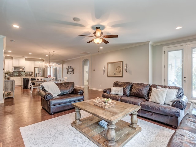 314 Candella Dr, Matthews, NC 28104 - living room with arched walkways, a ceiling fan, dark wood finished floors, recessed lighting, and ornamental molding