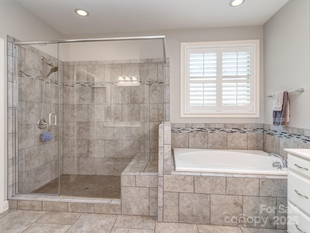 314 Candella Dr, Matthews, NC 28104 - full bath featuring a bath, a shower stall, recessed lighting, and vanity