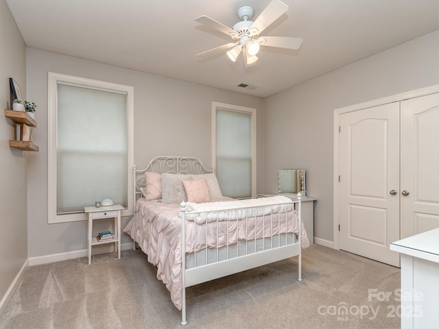 314 Candella Dr, Matthews, NC 28104 - bedroom with light colored carpet, baseboards, and ceiling fan