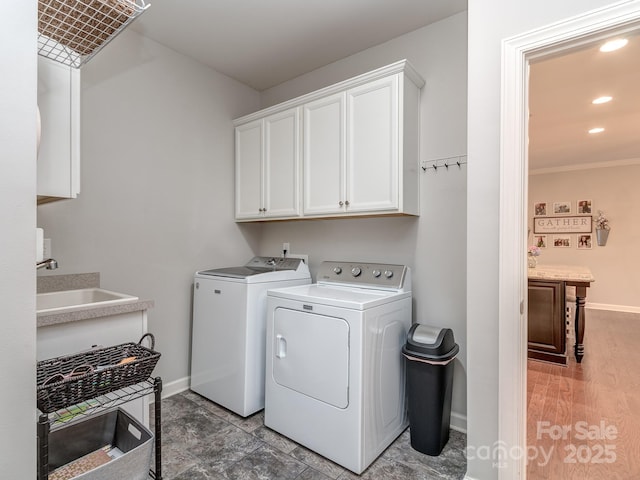 314 Candella Dr, Matthews, NC 28104 - laundry room with cabinet space, washer and clothes dryer, baseboards, recessed lighting, and crown molding