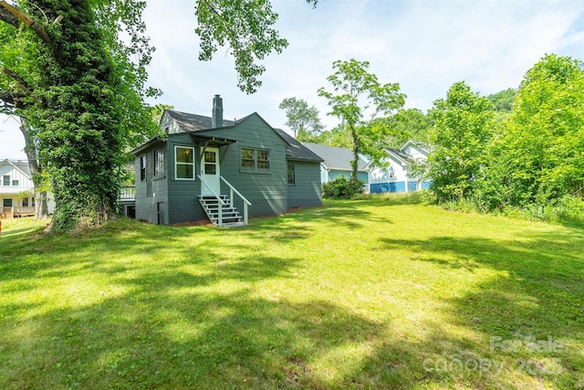 12 Mountain View Ave, Black Mountain, NC 28711 - back of property with a chimney and a lawn