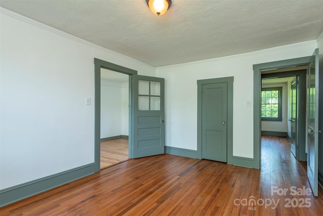 12 Mountain View Ave, Black Mountain, NC 28711 - empty room featuring wood finished floors, crown molding, and a textured ceiling