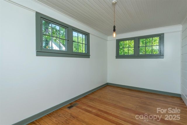 12 Mountain View Ave, Black Mountain, NC 28711 - empty room with healthy amount of natural light, wood finished floors, and crown molding