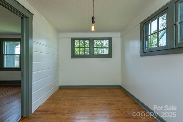 12 Mountain View Ave, Black Mountain, NC 28711 - empty room with ornamental molding, plenty of natural light, and wood finished floors