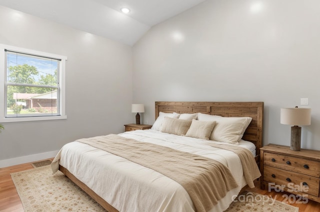 1844 Bellcroft Ln, Lenoir, NC 28645 - bedroom with lofted ceiling and light wood-style flooring