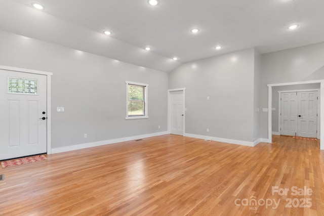 1844 Bellcroft Ln, Lenoir, NC 28645 - unfurnished living room featuring light wood-style flooring, vaulted ceiling, and recessed lighting