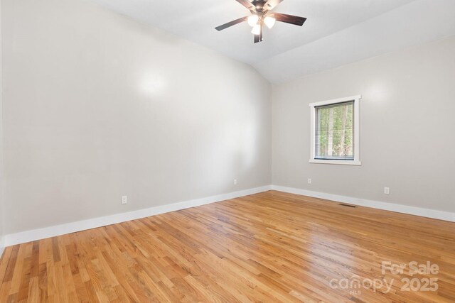 1844 Bellcroft Ln, Lenoir, NC 28645 - unfurnished room featuring lofted ceiling, a ceiling fan, and light wood-style floors