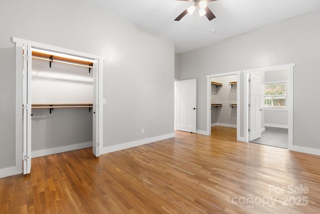 1844 Bellcroft Ln, Lenoir, NC 28645 - unfurnished bedroom with wood finished floors, a spacious closet, and a ceiling fan