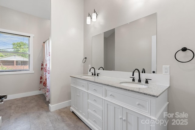 1844 Bellcroft Ln, Lenoir, NC 28645 - bathroom with double vanity and baseboards