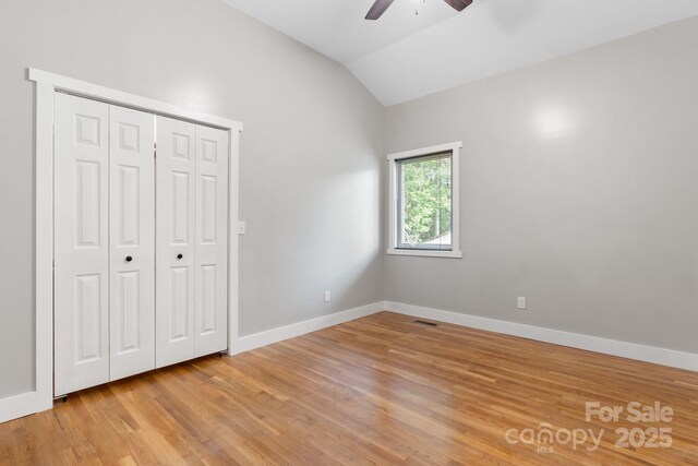 1844 Bellcroft Ln, Lenoir, NC 28645 - unfurnished bedroom featuring vaulted ceiling, light wood-style flooring, a closet, and ceiling fan