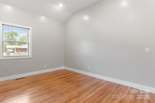 1844 Bellcroft Ln, Lenoir, NC 28645 - empty room featuring vaulted ceiling and light wood-type flooring