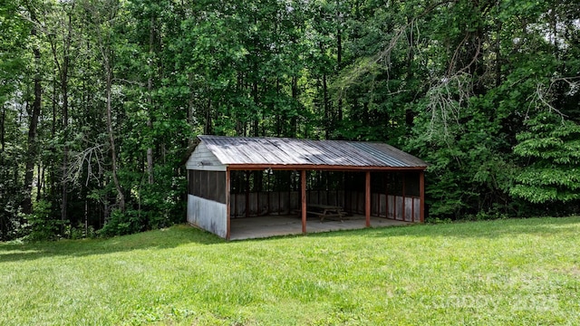 1844 Bellcroft Ln, Lenoir, NC 28645 - view of grassy yard with a pole building, an outdoor structure, and a view of trees