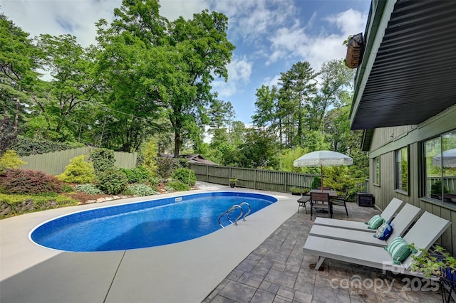 19 Poplar Ct, Hendersonville, NC 28792 - view of swimming pool featuring a patio area, a fenced backyard, and outdoor dining space