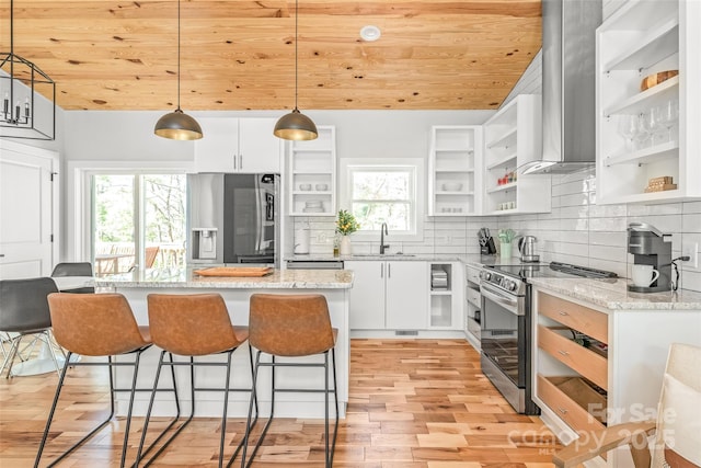 163 Hawk Hollow Dr, Lake Lure, NC 28746 - kitchen featuring open shelves, appliances with stainless steel finishes, wall chimney exhaust hood, wooden ceiling, and light wood-style floors