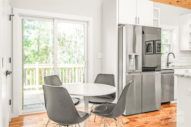 163 Hawk Hollow Dr, Lake Lure, NC 28746 - dining space with plenty of natural light and light wood-type flooring