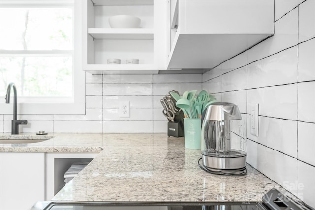 163 Hawk Hollow Dr, Lake Lure, NC 28746 - kitchen with tasteful backsplash, open shelves, white cabinetry, and light stone counters