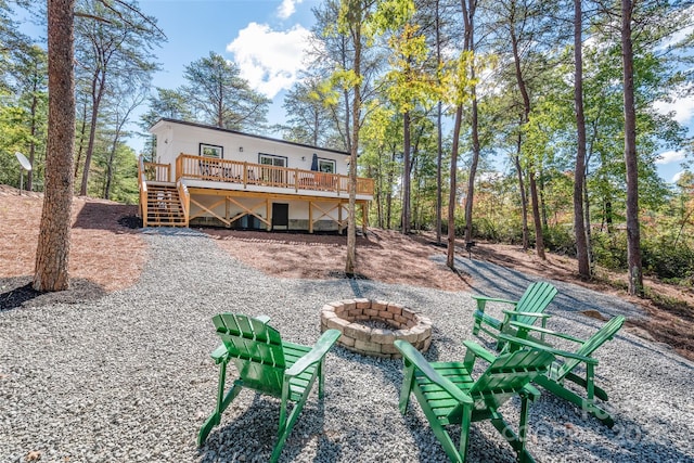 163 Hawk Hollow Dr, Lake Lure, NC 28746 - back of property featuring an outdoor fire pit, a deck, and stairway