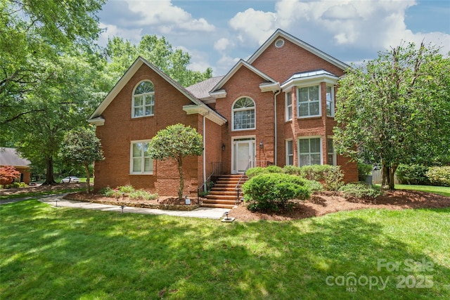 7301 Leharne Dr, Charlotte, NC 28270 - view of front of property with a front yard and brick siding