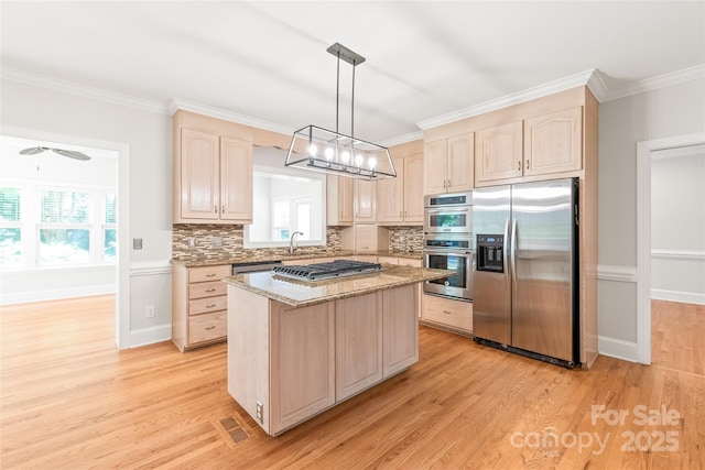 7301 Leharne Dr, Charlotte, NC 28270 - kitchen featuring appliances with stainless steel finishes, light brown cabinetry, light wood-style floors, and crown molding