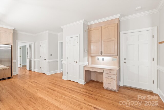 7301 Leharne Dr, Charlotte, NC 28270 - kitchen with stainless steel fridge, light brown cabinetry, light wood-style floors, and ornamental molding