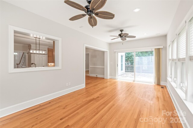 7301 Leharne Dr, Charlotte, NC 28270 - unfurnished room with a ceiling fan, wood finished floors, a chandelier, and recessed lighting
