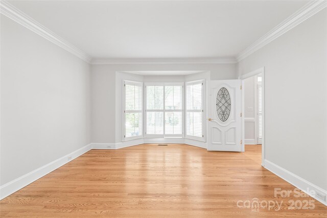 7301 Leharne Dr, Charlotte, NC 28270 - empty room featuring crown molding and light wood-type flooring