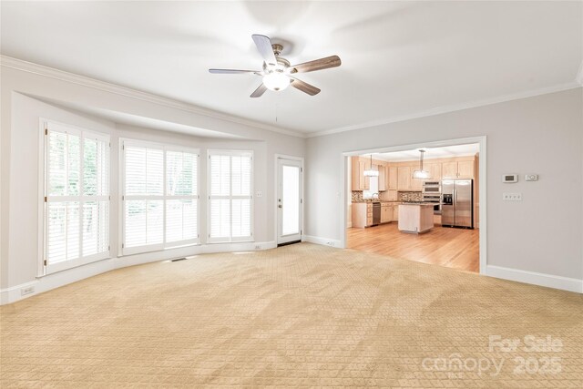 7301 Leharne Dr, Charlotte, NC 28270 - unfurnished living room featuring light colored carpet, crown molding, and a ceiling fan
