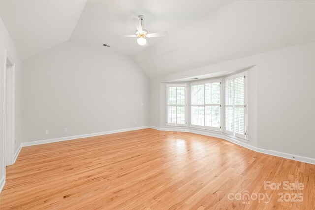 7301 Leharne Dr, Charlotte, NC 28270 - unfurnished room with a ceiling fan, light wood-style floors, and vaulted ceiling